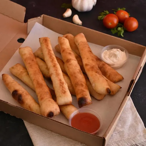 Trae Pizza - Pizzería Artesanal - Recreo